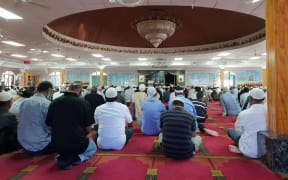 President of the South Auckland Muslim Association addresses mourners in the mosque.