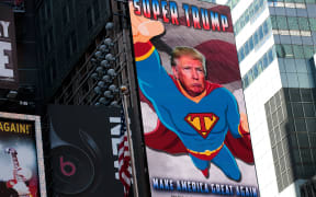A digital billboard supporting Donald Trump depicts him as 'Super Trump' in Times Square, September 15, 2016 in New York City.