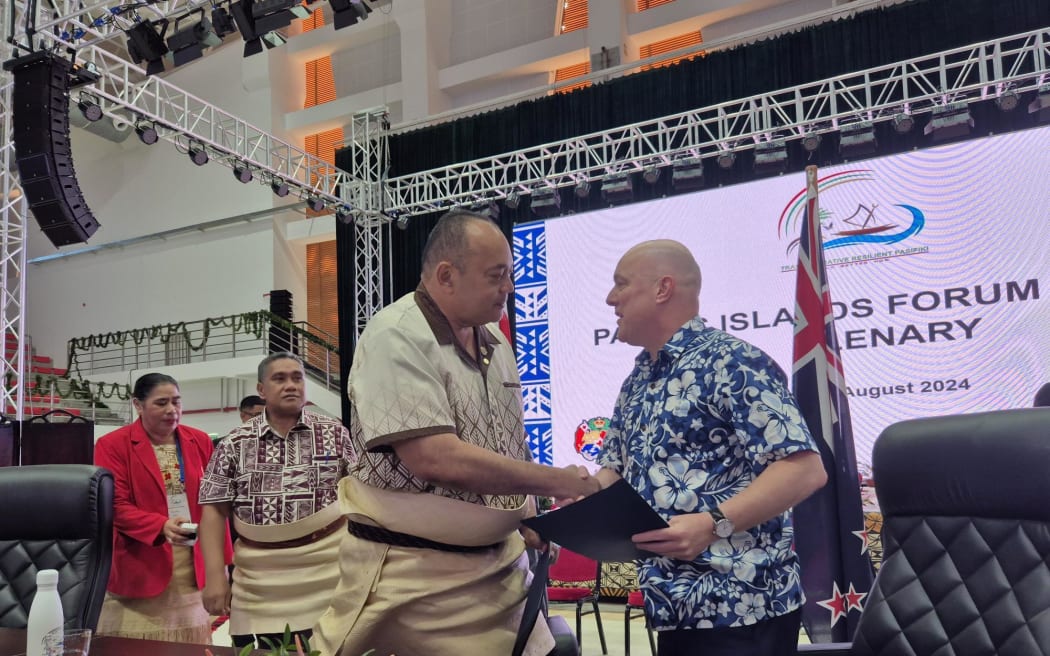Prime Minister Christopher Luxon has arrived at the 2024 PIF in Tonga. New Zealand has just signed a statement of partnership with Tonga. Luxon pictured here with Tonga Prime Minister and forum chair Hu'akavameiliku.