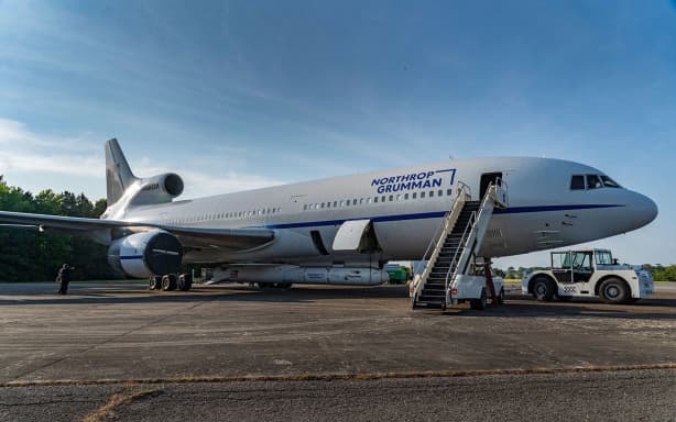A Northrop Grumman Pegasus XL rocket is affixed to the bottom of the Stargazer aircraft.