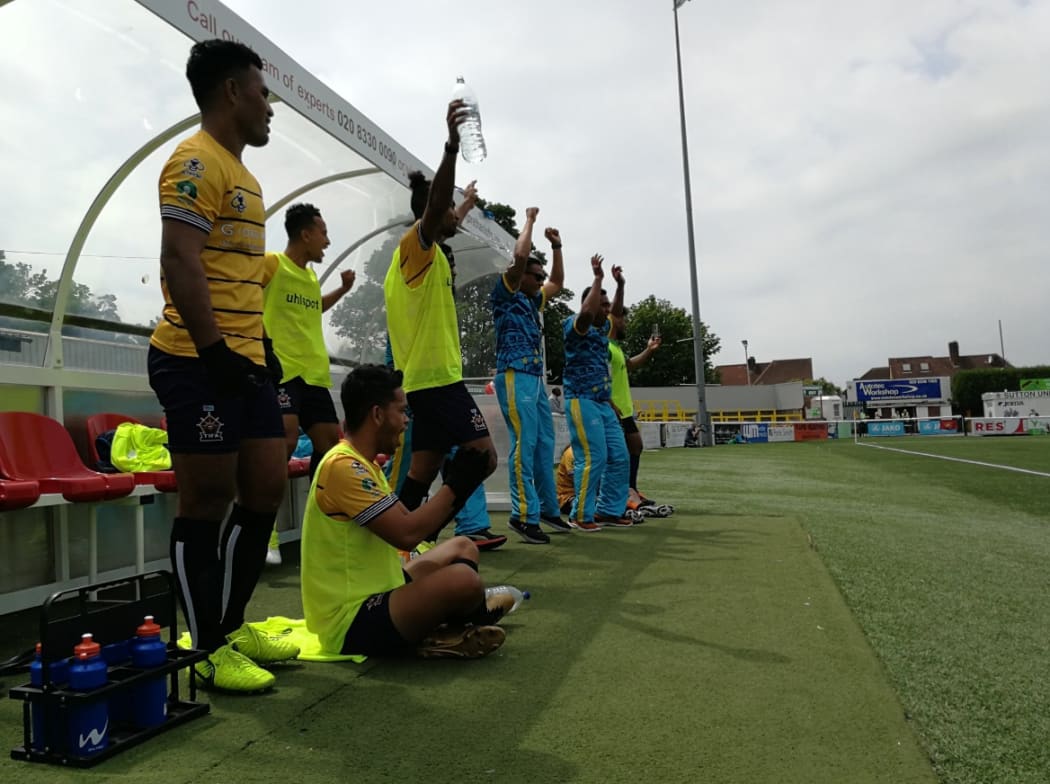 Tuvalu celebrate their second goal.
