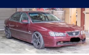 An image of the maroon Holden Commodore police are seeking sightings of.