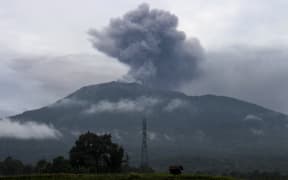 Ash continued to rise from Mount Marapi on 4 December, as seen from Batu Palano village, a day after the volcano erupted.