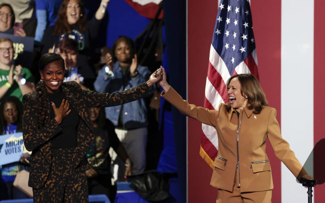 US Vice President and Democratic presidential candidate Kamala Harris and former US First Lady Michelle Obama campaign together at the Wings Event Center in Kalamazoo, Michigan, 26 October, 2024.