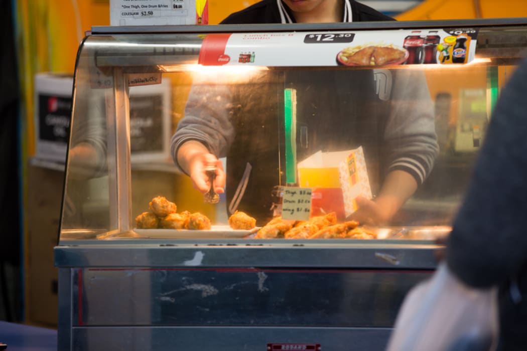 Fried chicken being served up at a takeaway in Mangere Town Centre