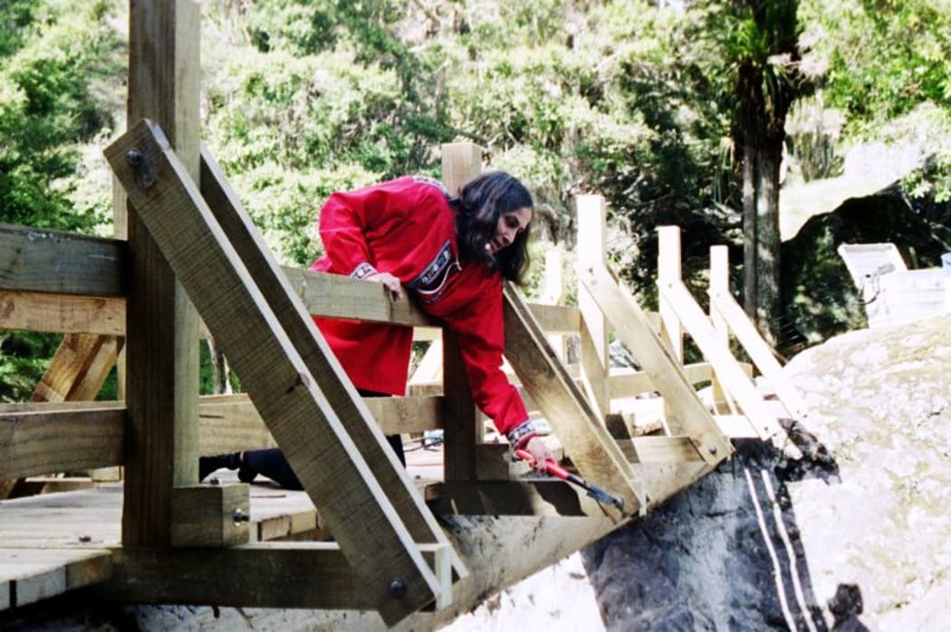 This is an image of Rita checking bolts on one of the bridges  2002