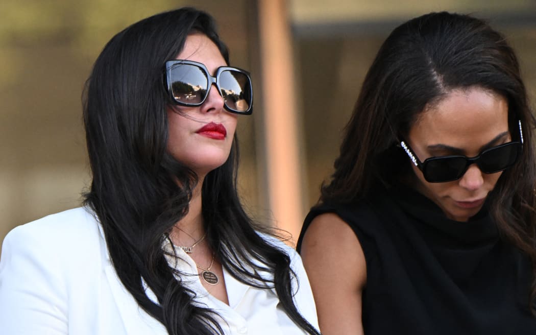 Vanessa Bryant (L), widow of the Los Angeles Lakers basketball player Kobe Bryant, and close friend Sydney Leroux (R) depart the court house in Los Angeles, California, on 24 August, 2022, after a verdict was reached in Bryant's federal negligence lawsuit against Los Angeles County. A jury ordered Los Angeles County to pay US$31 million in damages over graphic photos taken by sheriff's deputies and firefighters of the helicopter crash that killed basketball star Kobe Bryant.