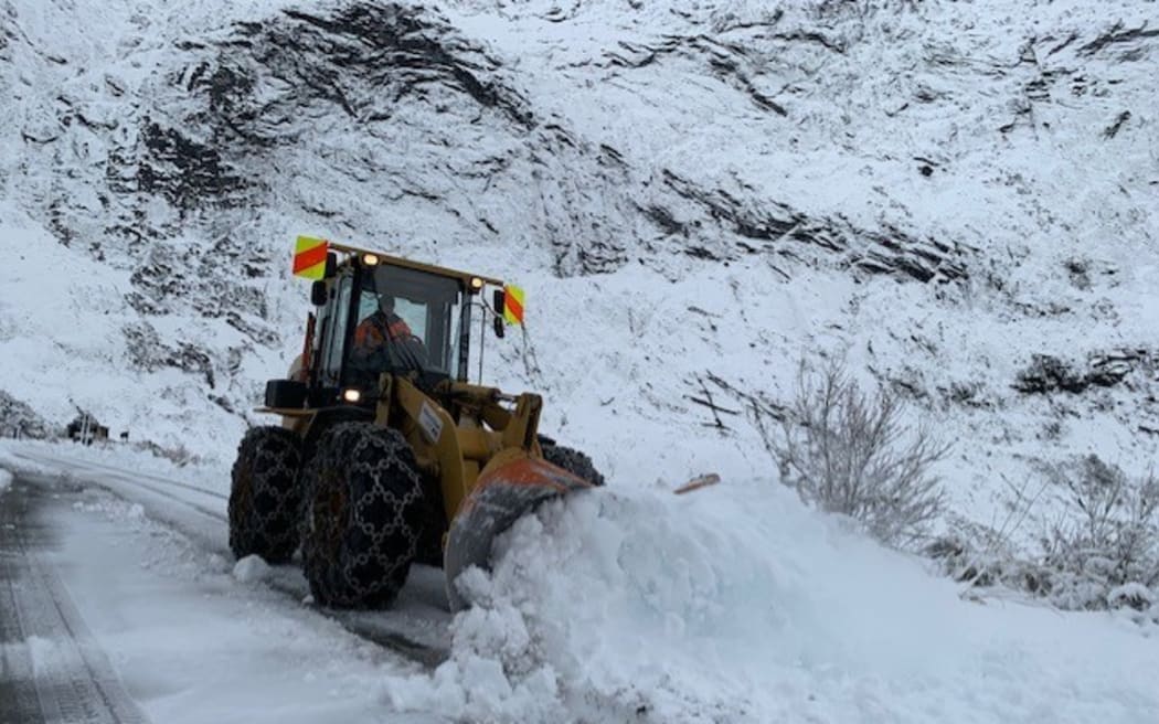 A snow plough at work on the Milford Road near Queenstown.