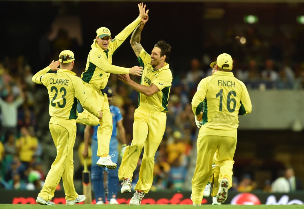 (From left) Australia's Michael Clarke, Steven Smith, Mitchell Johnson and Aaron Finch celebrate the wicket of India's Ravindra Jadeja during the 2015 Cricket World Cup semi-final match between Australia and India in Sydney on March 26, 2015.