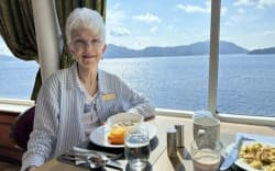 Sharon Lane enjoys life on board, especially the ocean views. Here she is eating breakfast.