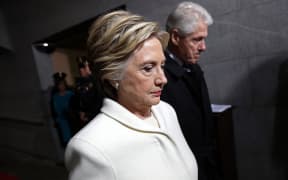 Former Democratic presidential nominee Hillary Clinton and former US President Bill Clinton arrive on the West Front of the US Capitol on January 20, 2017 in Washington, DC. Donald Trump took the first ceremonial steps before being sworn in as the 45th president of the United States Friday -- ushering in a new political era that has been cheered and feared in equal measure. (Photo by Win McNamee / various sources / AFP)