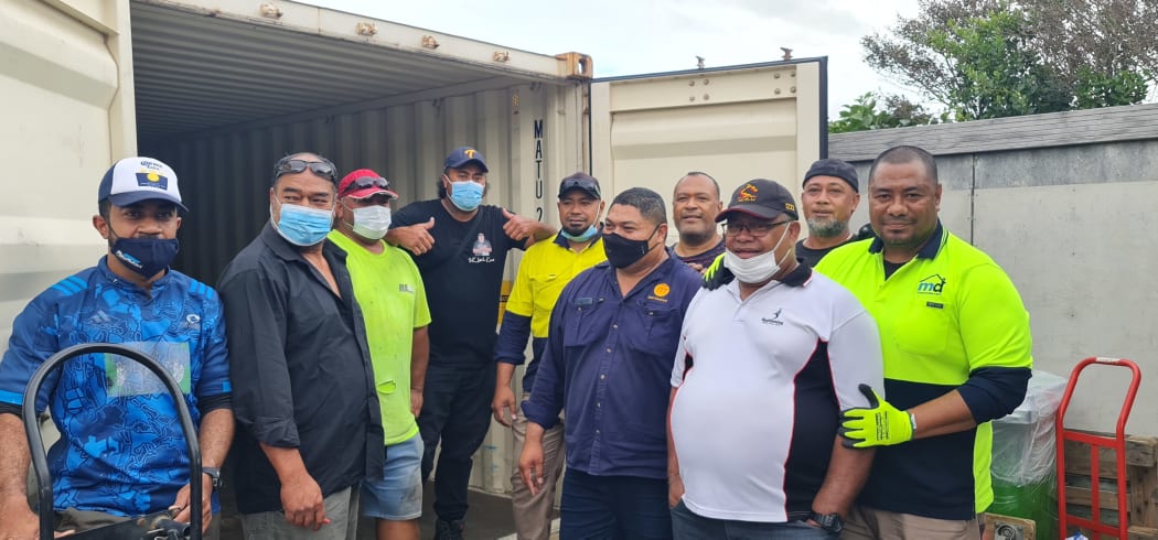Loading the containers has been hard work as the supply barrels, many full of tinned food, are very heavy.  Fortunately, many local Tongan men in the area have turned up, often after finishing work, to complete the task.