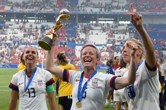 USA's players including Megan Rapinoe , centre, celebrate their World Cup title win.