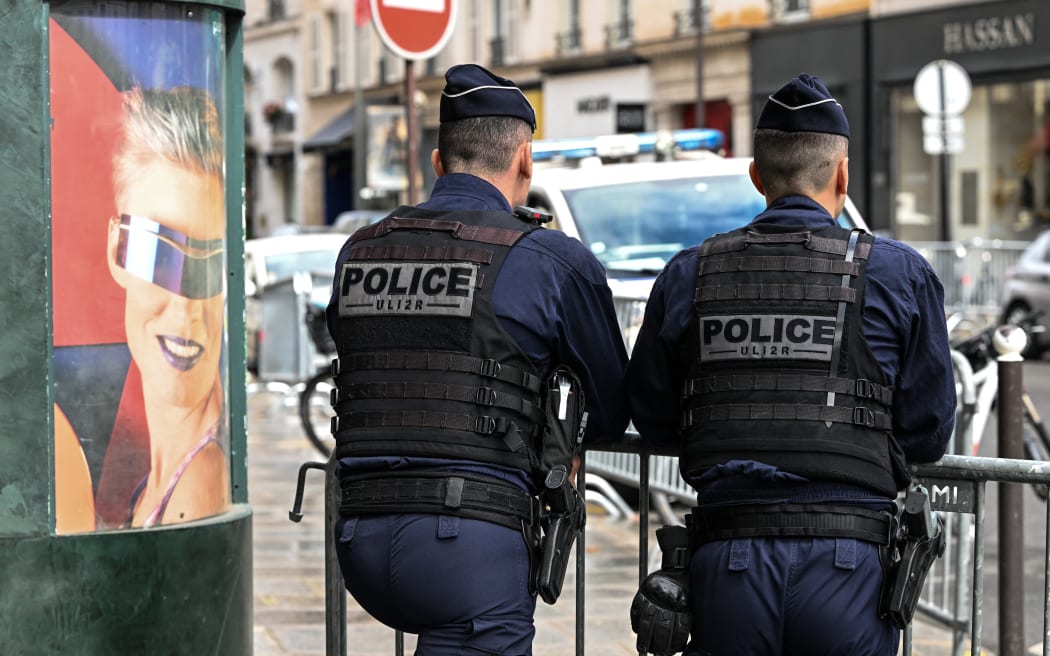 PARIS, FRANCE - JULY 17:   
Members of the National Police at the check-point securing the arrival of French government members ahead of the Conseil des Ministres at the Elysee Palace, on July 17, 2024, in Paris France. (Photo by Artur Widak/NurPhoto) (Photo by Artur Widak / NurPhoto / NurPhoto via AFP)