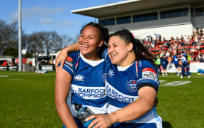 Maama Vaipulu of Auckland and Chryss Viliko of Auckland celebrate winning  the Farah Palmer Cup 2023