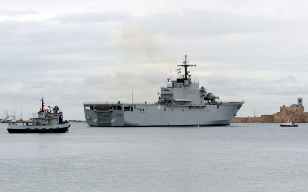 Italian Navy ship the San Giorgio leaves the port of Brindisi to take part in the rescue operations of the burning ferry Norman Atlantic.