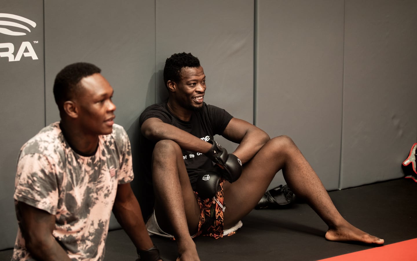 Blood Diamond sitting with Israel Adesanya at City Kickboxing at training begins.