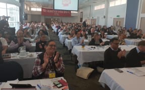 PPTA conference delegates applaud a speaker, October 2018.