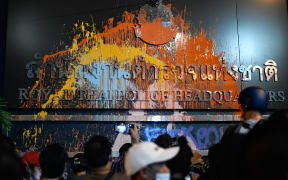 A banner of the Royal Thai Police Headquarters was spray-painted by protesters during an anti-government rally outside the Royal Thai Police Headquarters in Bangkok, Thailand.