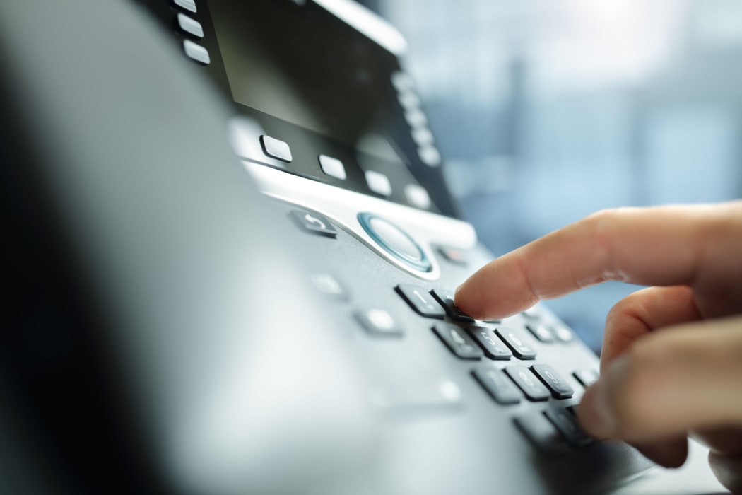 Dialing a telephone keypad.