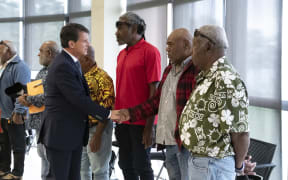French Overseas Minister Manuel Valls (L) greets members of the Customary Senate in Noumea, in the French overseas collectivity of New Caledonia, on August 20, 2025. Valls is in New Caledonia in an attempt to rescue the Bougival agreement. The Kanak and Socialist National Liberation Front (FLNKS), New Caledonia's main pro-independence movement, confirmed on August 13 its rejection of the Bougival agreement, signed on July 12 with the French government, which would redefine the institutional future of the archipelago. (Photo by Delphine MAYEUR / AFP)