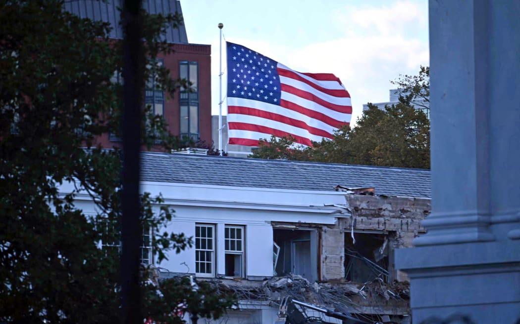 Heavy machinery tears down a section of the East Wing of the White House as construction begins on President Donald Trump’s planned ballroom, in Washington, DC, on October 20, 2025. US President Donald Trump held a glitzy dinner October 15, 2025 to thank billionaires and top companies for donating to the new $250 million ballroom he is building at the White House. The guests included representatives from tech firms like Amazon, Apple, Meta, Google, Microsoft and Palantir and defense giant Lockheed Martin, according to US media citing a White House guest list. (Photo by Pedro UGARTE / AFP)