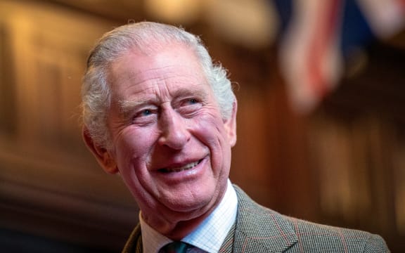 Britain's King Charles III reacts as he meets with families from Afghanistan, Syria and Ukraine who have settled in Aberdeen, during a visit to Aberdeen Town House, on October 17, 2022. (Photo by Jane Barlow / POOL / AFP)