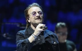 Bono of the Irish rock band U2 performs during the "Experience + Innocence" tour at the United Center in Chicago on May 23, 2018. / AFP PHOTO / Kamil Krzaczynski
