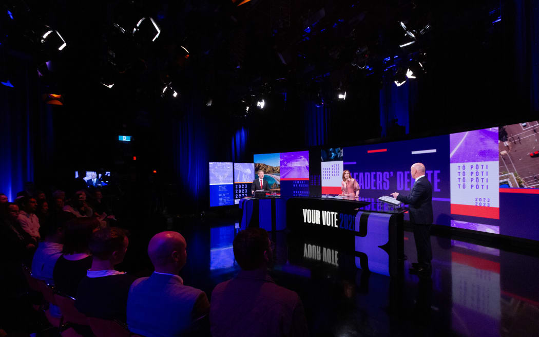 Labour leader Chris Hipkins and National leader Chris Luxon at TVNZ's second leaders' debate, with moderater, 1News Political Editor Jessica Mutch McKay.