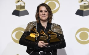Brandi Carlile, winner of the awards for best Americana album for "By The Way, I Forgive You", best American roots performance for "The Joke", and best American roots song for "The Joke" poses at the 61st annual Grammy Awards at the Staples Center on Sunday, Feb. 10, 2019, in Los Angeles. (