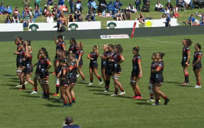 Ruby Tui and Arihiana Marino-Tauhinu stand aside from the Chiefs Manawa haka.