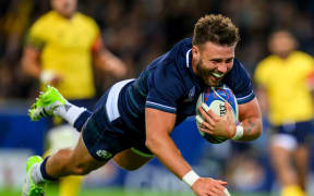 Scotland’s Ali Price scores a try against Romania.