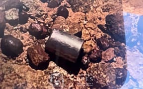 This handout from the Government of Western Australia's Department of Fire and Emergency Services taken and received on February 1, 2023 shows a radioactive capsule, which had fallen off a truck, after it was found along a desert highway south of Newman, Western Australia. - A tiny but dangerously radioactive capsule, which fell off a truck along a remote stretch of Outback highway in Western Australia last month, was found on February 1, authorities said. (Photo by Handout / various sources / AFP) / -----EDITORS NOTE --- RESTRICTED TO EDITORIAL USE - MANDATORY CREDIT "AFP PHOTO / GOVERNMENT OF WESTERN AUSTRALIA / DEPARTMENT OF FIRE AND EMERGENCY SERVICES " - NO MARKETING - NO ADVERTISING CAMPAIGNS - DISTRIBUTED AS A SERVICE TO CLIENTS
