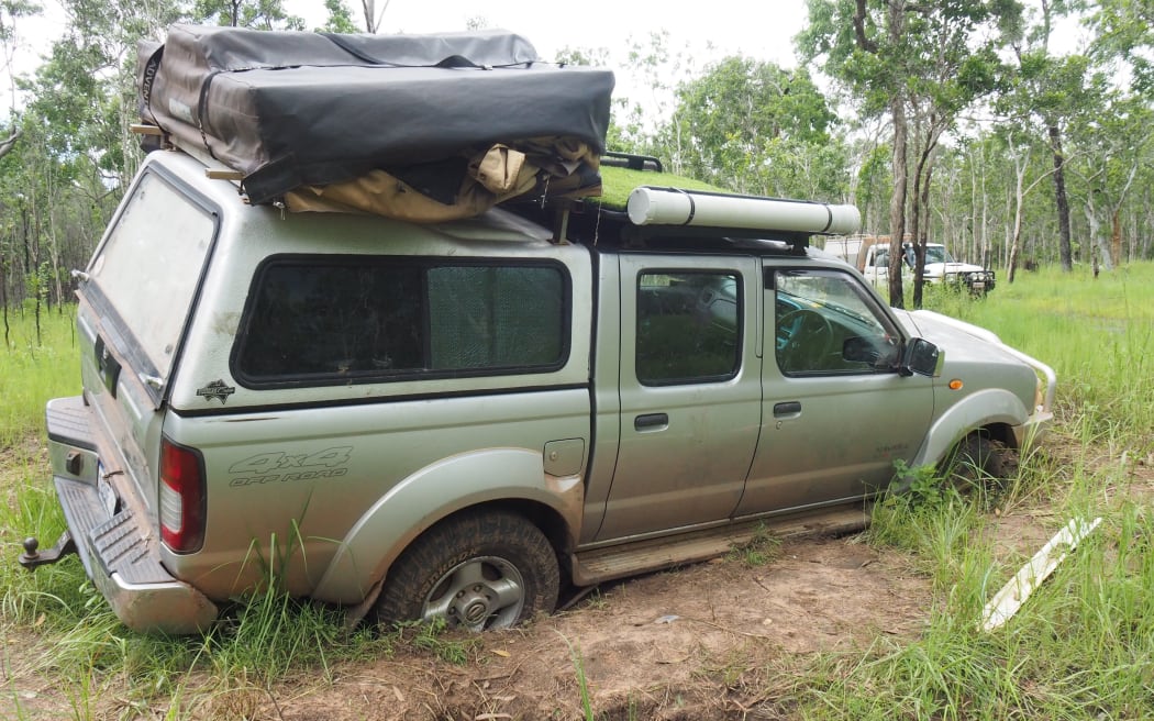 The men's car became bogged in muddy terrain and was later recovered.