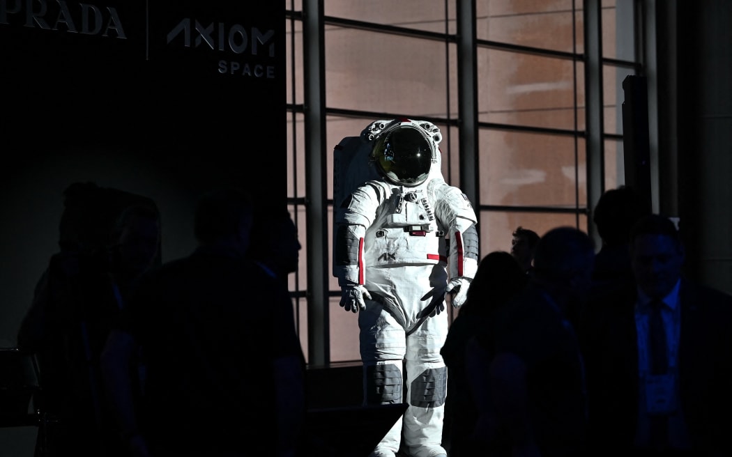 The AxEMU suit is pictured during a press conference of Prada and Axiom Space, as part of the presentation of the Axiom Extravehicular Mobility Unit designed and developed for the Artemis 3 lunar mission in collaboration with Prada, at the MiCo Convention Centre in Milan, northern Italy, on October 16, 2024. - Astronauts walking on the moon as part of NASA's first human mission to the lunar South Pole will be wearing Prada, as part of a new venture unveiled on October 16, 2024. Private space company Axiom Space teamed up with the Italian luxury brand to provide the surface suits and spacewalk systems for NASA's Artemis 3 mission, which is planned for September 2026. (Photo by MARCO BERTORELLO / AFP)