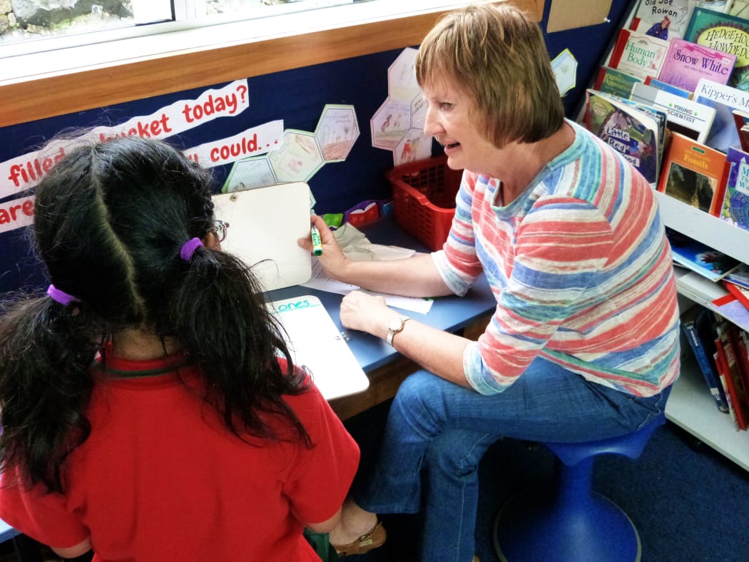 Sunnydene Special School outreach teacher Glennis Keown works with a child at Newmarket School in Auckland