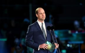 Britain's Prince William, Prince of Wales speaks on stage inside Windsor Castle grounds at the Coronation Concert, in Windsor, west of London on May 7, 2023. - For the first time ever, the East Terrace of Windsor Castle will host a spectacular live concert that will also be seen in over 100 countries around the world. The event will be attended by 20,000 members of the public from across the UK.