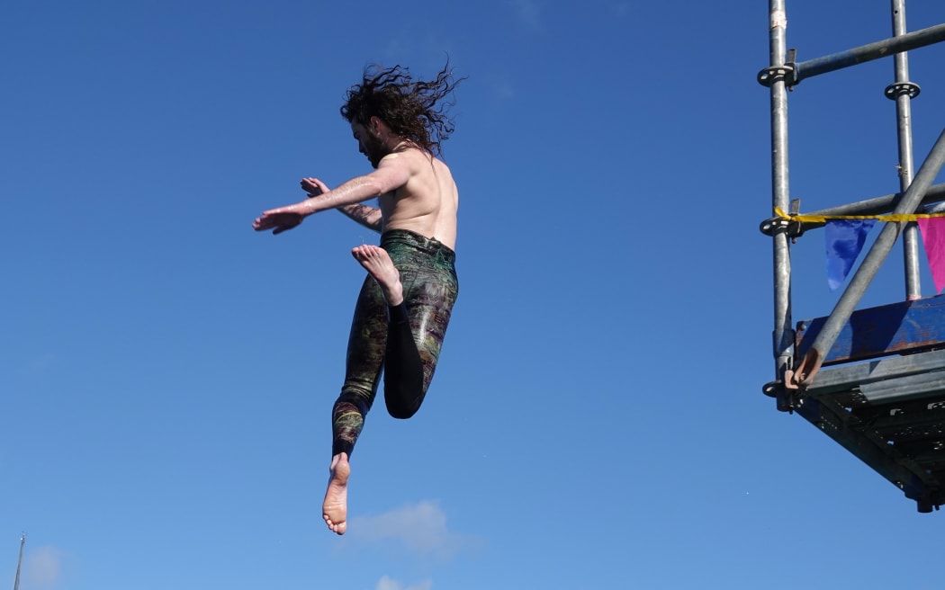 Toby Johnston, of Paihia Dive, takes the leap.