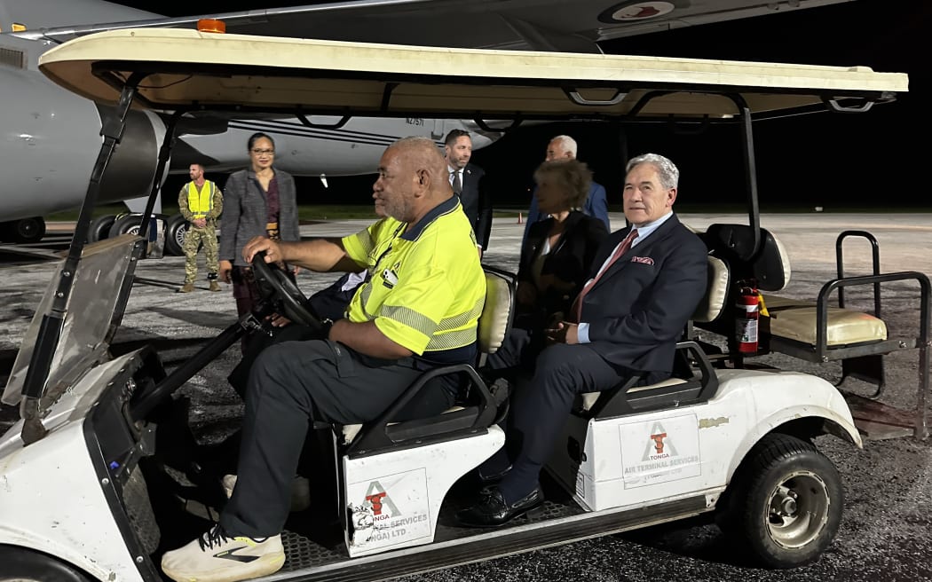 Winston Peters is transported on the tarmac from RNZAF aircraft after landing in Nukualofa