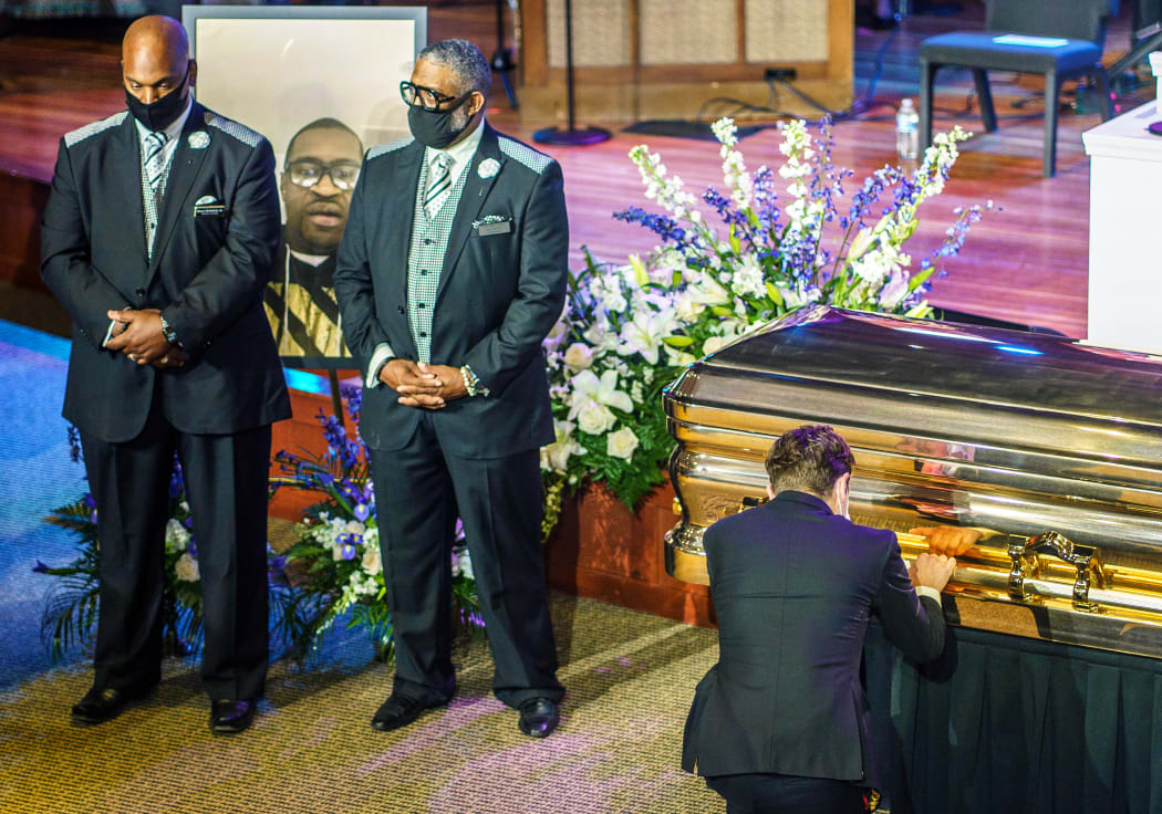 Minneapolis Mayor Jacob Frey, right,  pays his respects at the memorial service for George Floyd in Minneapolis, Minnesota.
