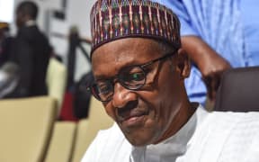 Nigerian president Muhammadu Buhari looks on during the African Union summit at the palais des Congres in Niamey, on July 7, 2019.