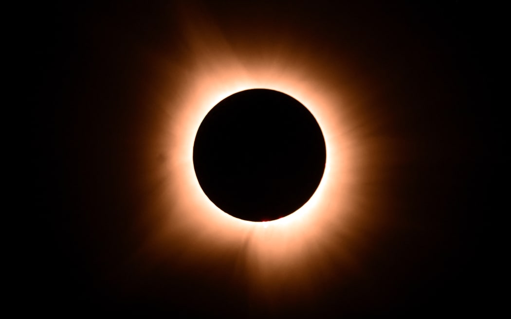 The moon eclipses the sun on 8 April 2024 across North America, seen from Bloomington, Indiana.