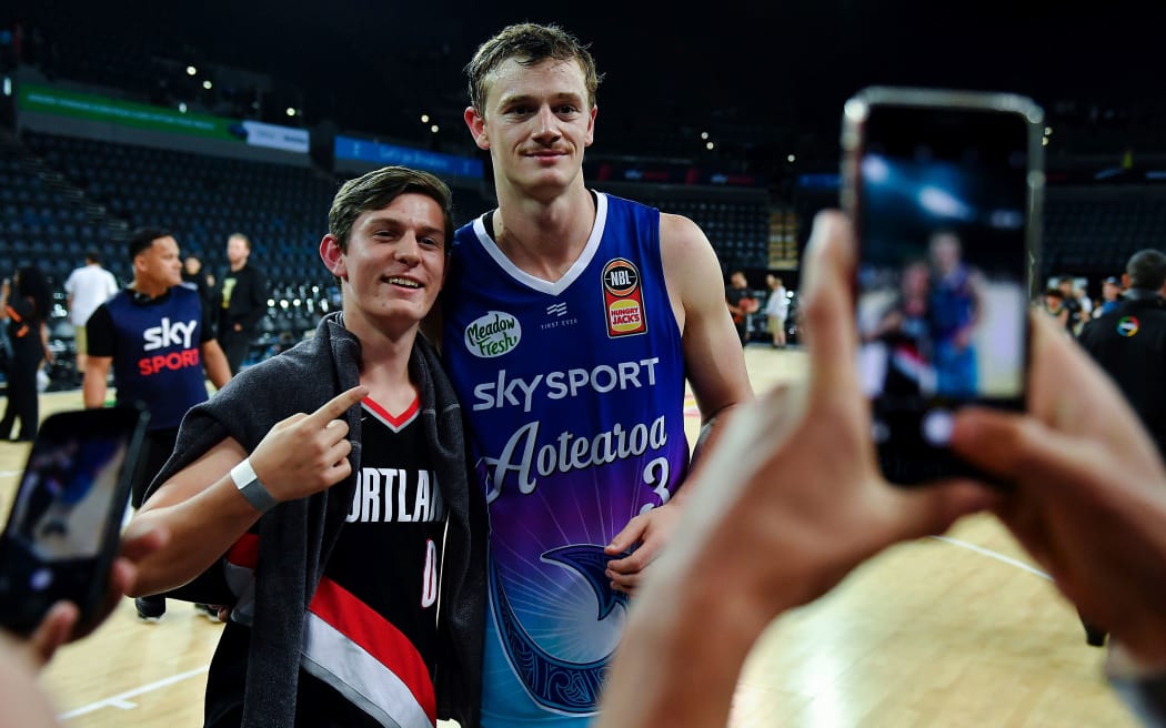 Breakers Finn Delany poses with a fan.