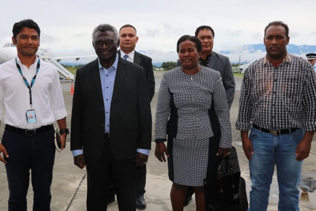 Solomon Islands prime minister Manasseh Sogavare (second from left) and his wife, Madam Emmy, along with officials, prepare to depart to New York for a UN meeting.