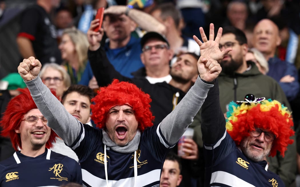 Supporters cheer ahead of the France 2023 Rugby World Cup semi-final match between Argentina and New Zealand at the Stade de France in Saint-Denis, on the outskirts of Paris, on October 20, 2023. (Photo by Anne-Christine POUJOULAT / AFP)