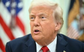 US President Donald Trump speaks as he signs an executive order targeting ticket scalping in the Oval Office of the White House in Washington, DC, on March 31, 2025. (Photo by SAUL LOEB / AFP)
