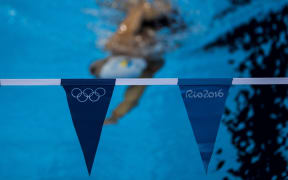 A swimmer practices at the Olympic Aquatics stadium, in Rio de Janeiro, ahead of the 2016 Olympic games.