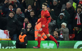 Ben Woodburn celebrates his goal for Liverpool, which made him the club's youngest ever goalscorer