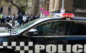 Police officers in undercover uniform are seen during a demonstration organised by a global environmental movement group Extinction Rebellion that started at The State Library, in Melbourne, Australia on Friday, March 26, 2021.