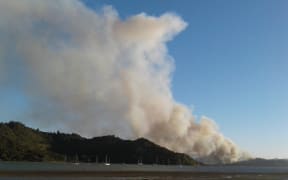 A photo taken about 7.50pm shows a fire burning near the town of Whitianga.